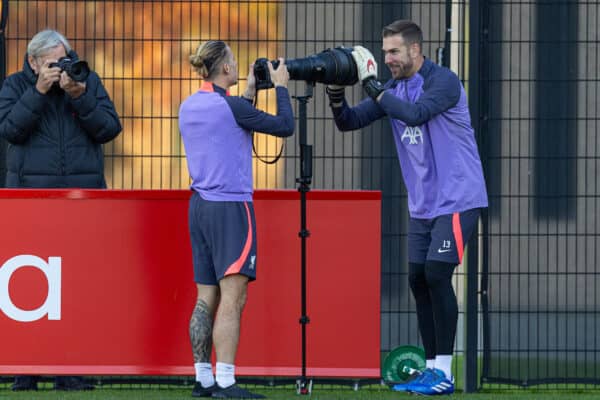 LIVERPOOL, ENGLAND - Wednesday, October 25, 2023: Liverpool's Kostas Tsimikas (L) and goalkeeper Adrián San Miguel del Castillo play with a photographer's camera during a training session at the AXA Training Centre ahead of the UEFA Europa League Group E match between Liverpool FC and FC Toulouse. (Photo by David Rawcliffe/Propaganda)