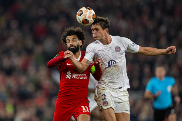 LIVERPOOL, ENGLAND - Thursday, October 26, 2023: Liverpool's captain Mohamed Salah (L) is challenged by Toulouse's Rasmus Nicolaisen during the UEFA Europa League Group E matchday 3 game between Liverpool FC and Toulouse FC at Anfield. (Photo by David Rawcliffe/Propaganda)