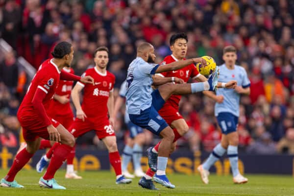 LIVERPOOL, ENGLAND - Saturday, November 11, 2023: Liverpool's Wataru Endo (R) is challenged by Brentford's Bryan Mbeumo during the FA Premier League match between Liverpool FC and Brentford FC at Anfield. (Photo by David Rawcliffe/Propaganda)