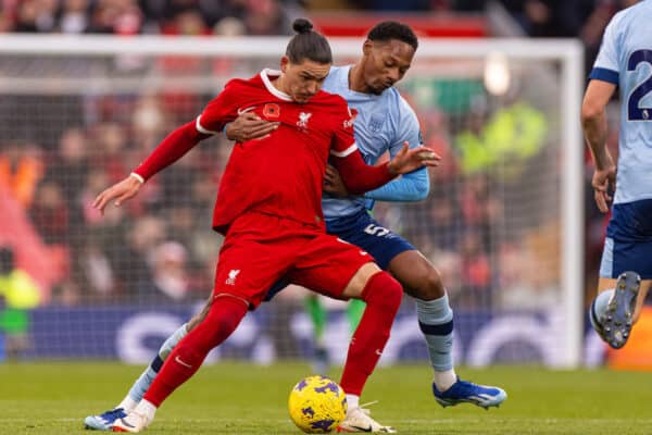 LIVERPOOL, ENGLAND - Saturday, November 11, 2023: Liverpool's Darwin Núñez (L) is challenged by Brentford's Ethan Pinnock during the FA Premier League match between Liverpool FC and Brentford FC at Anfield. (Photo by David Rawcliffe/Propaganda)