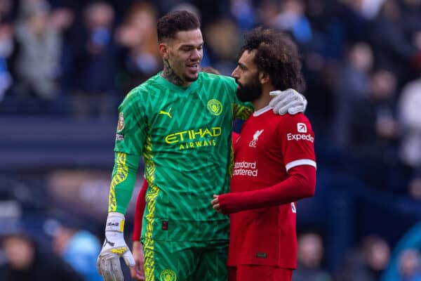 MANCHESTER, ENGLAND - Saturday, November 25, 2023: Manchester City's goalkeeper Ederson Santana de Moraes (L) and Liverpool's Mohamed Salah at the final whistle during the FA Premier League match between Manchester City FC and Liverpool FC at the City of Manchester Stadium. (Photo by David Rawcliffe/Propaganda)