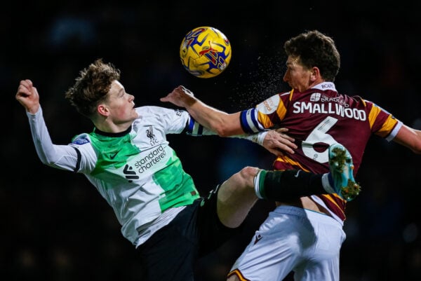 BRADFORD, ENGLAND - Tuesday, December 5, 2023: Liverpool's James McConnell (L) challenges for a header with Bradford City's captain Richie Smallwood during the English Football League Trophy Round of 32 match between Bradford City AFC and Liverpool FC Under-21's at Valley Parade. (Photo by Ed Sykes/Propaganda)