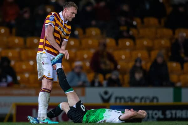 BRADFORD, ENGLAND - Tuesday, December 5, 2023: Liverpool's Ben Doak gioes down with an injury as Bradford City's Ciaran Kelly helps during the English Football League Trophy Round of 32 match between Bradford City AFC and Liverpool FC Under-21's at Valley Parade. (Photo by Ed Sykes/Propaganda)