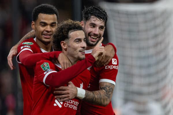 LIVERPOOL, ENGLAND - Wednesday, December 20, 2023: Liverpool's Curtis Jones (c) celebrates with team-mates Cody Gakpo (L) and Dominik Szoboszlai (R) after scoring the second goal, the club's 500th in the competition. during the Football League Cup Quarter-Final match between Liverpool FC and West Ham United FC at Anfield. (Photo by David Rawcliffe/Propaganda)