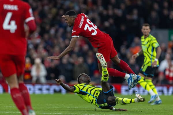 LIVERPOOL, ENGLAND - Saturday, December 23, 2023: Arsenal's Bukayo Saka, already on a yellow card, takes out Liverpool's Ryan Gravenberch with a reckless challenge but no second yellow is shown, during the FA Premier League match between Liverpool FC and Arsenal FC at Anfield. (Photo by David Rawcliffe/Propaganda)