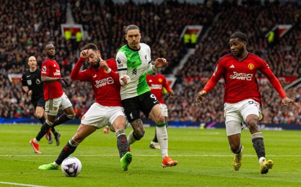 MANCHESTER, ENGLAND - Sunday, April 7, 2024: Liverpool's Darwin Núñez (C) is challenged by Manchester United's captain Bruno Fernandes during the FA Premier League match between Manchester United FC and Liverpool FC at Old Trafford. (Photo by David Rawcliffe/Propaganda)