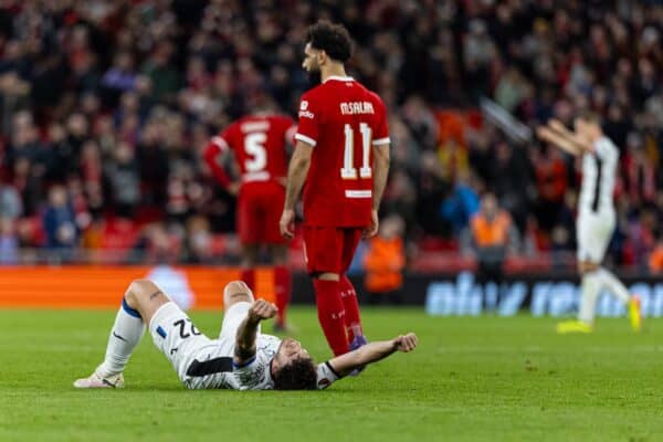 LIVERPOOL, ENGLAND - Thursday, April 11, 2024: Atalanta's Matteo Ruggeri celebrates at the final whistle as Liverpool's Mohamed Salah looks dejected during the UEFA Europa League Quarter-Final 1st Leg match between Liverpool FC and BC Atalanta at Anfield. Atalanta won 3-0. (Photo by David Rawcliffe/Propaganda)