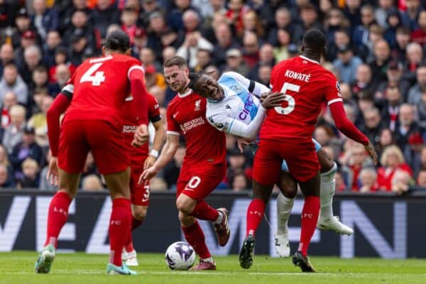 LIVERPOOL, ENGLAND - Sunday, April 14, 2024: Crystal Palace's Eberechi Eze is challenged by Liverpool's Alexis Mac Allister (L) and Ibrahima Konaté (R) during the FA Premier League match between Liverpool FC and Crystal Palace FC at Anfield. (Photo by David Rawcliffe/Propaganda)