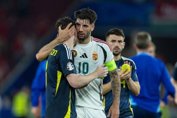 STUTTGART, GERMANY - Sunday, June 23, 2024: Hungary's captain Dominik Szoboszlai (R) consoles Liverpool team-mate Scotland's captain Andy Robertson at the final whistle during the UEFA Euro 2024 Group A match between Scotland and Hungary at the Stuttgart Arena. Hungary won 1-0. (Photo by David Rawcliffe/Propaganda)