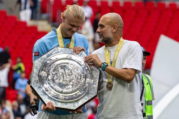 LONDON, ENGLAND - Saturday, August 10, 2024: Manchester City's Erling Haaland (L) and manager Josep 'Pep' Guardiola celebrate with the trophy after the FA Community Shield match between Manchester City FC and Manchester United FC at Wembley Stadium. Man City won 7-6 on penalties after a 1-1 draw. (Photo by David Rawcliffe/Propaganda)
