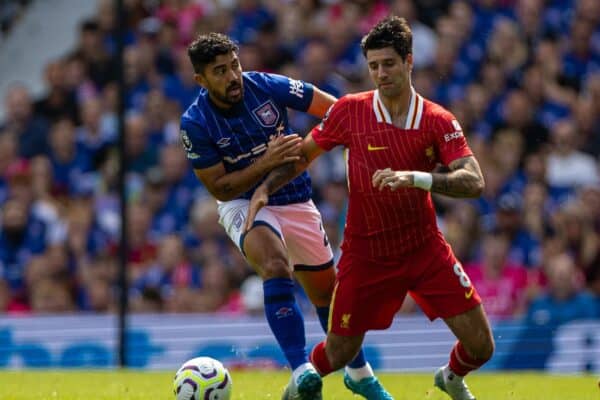 IPSWICH, ENGLAND - Saturday, August 17, 2024: Liverpool's Dominik Szoboszlai (R) is challenged by Ipswich Town's Massimo Luongo during the FA Premier League match between Ipswich Town FC and Liverpool FC at Portman Road. (Photo by David Rawcliffe/Propaganda)