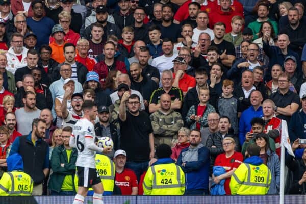 MANCHESTER, ENGLAND - Sunday, September 1, 2024: Manchester United supporters welcome Liverpool's Andy Robertson during the FA Premier League match between Manchester United FC and Liverpool FC at Old Trafford. (Photo by David Rawcliffe/Propaganda)