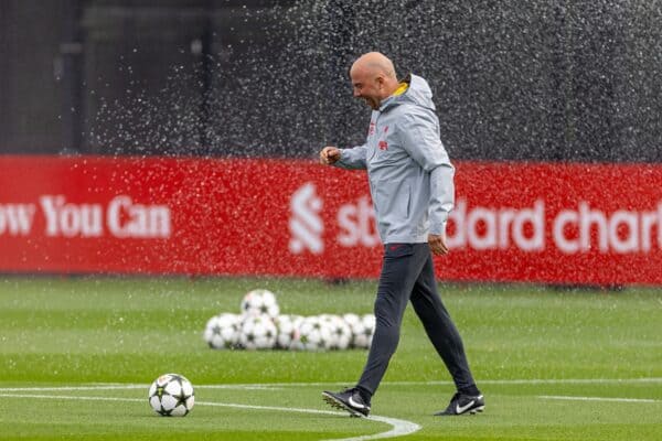 LIVERPOOL, ENGLAND - Tuesday, October 1, 2024: Liverpool's head coach Arne Slot gets caught by the sprinklers during a training session at the AXA Training Centre ahead of the UEFA Champions League match between Liverpool FC and Bologna FC. (Photo by David Rawcliffe/Propaganda)