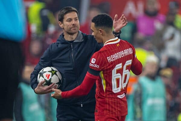 LIVERPOOL, ENGLAND - Tuesday, November 5, 2024: Bayer Leverkusen's head coach Xabi Alonso (L) hands the ball to Liverpool's Trent Alexander-Arnold during the UEFA Champions League game between Liverpool FC and Bayer Leverkusen at Anfield. (Photo by David Rawcliffe/Propaganda)