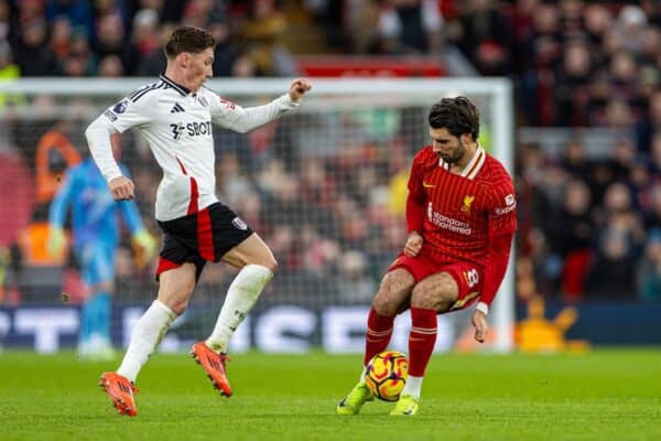 LIVERPOOL, ENGLAND - Saturday, December 14, 2024: Liverpool's Dominik Szoboszlai (R) stops Fulham's Harry Wilson during the FA Premier League match between Liverpool FC and Fulham FC at Anfield. (Photo by David Rawcliffe/Propaganda)
