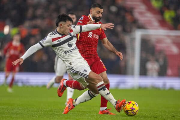 LIVERPOOL, ENGLAND - Sunday, January 5, 2025: Liverpool's Mohamed Salah (R) is challenged by Manchester United's Lisandro Martínez during the FA Premier League match between Liverpool FC and Manchester United FC at Anfield. (Photo by David Rawcliffe/Propaganda)