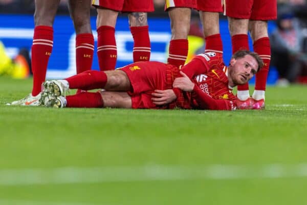 LIVERPOOL, ENGLAND - Tuesday, March 11, 2025: Liverpool's Alexis Mac Allister makes a 'draft excluder' in a defensive wall during the UEFA Champions League Round of 16 2nd Leg match between Liverpool FC and Paris Saint-Germain FC at Anfield. (Photo by David Rawcliffe/Propaganda)