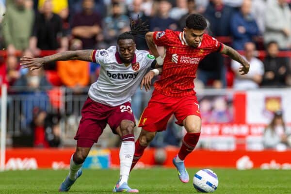 LIVERPOOL, ENGLAND - Sunday, April 13, 2025: Liverpool's Luis Díaz (R) is challenged by West Ham United's Aaron Wan-Bissaka during the FA Premier League match between Liverpool FC and West Ham United FC at Anfield. (Photo by David Rawcliffe/Propaganda)