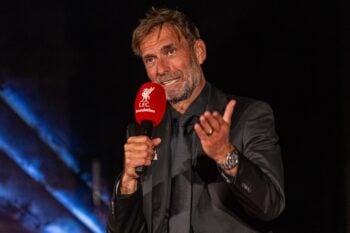 A man in a suit holding a microphone LFC Foundation Gala Ball