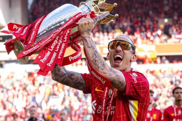 LIVERPOOL, ENGLAND - Sunday, May 25, 2025: Liverpool's Kostas Tsimikas lifts the trophy, as the team celebrate becoming Champions for the 20th time, after the FA Premier League match between Liverpool FC and Crystal Palace FC at Anfield. (Photo by David Rawcliffe/Propaganda)
