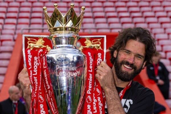 LIVERPOOL, ENGLAND - Sunday, May 25, 2025: Liverpool's goalkeeper Alisson Becker puts the trophy on the head of his daughter, as the Reds celebrate being crowned Champions for the 20th time, during the FA Premier League match between Liverpool FC and Crystal Palace FC at Anfield. (Photo by David Rawcliffe/Propaganda)