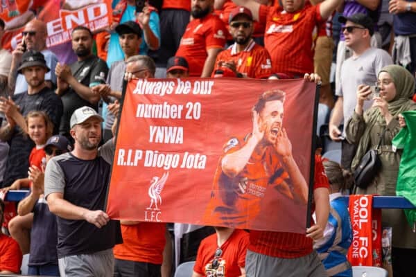 PRESTON, ENGLAND - Sunday, July 13, 2025: Liverpool fans walking in front of the away fans holding a banner in memory of Diogo Jota during a pre-season friendly match between Preston North End FC and Liverpool FC at Deepdale. (Photo by David Rawcliffe/Propaganda)
