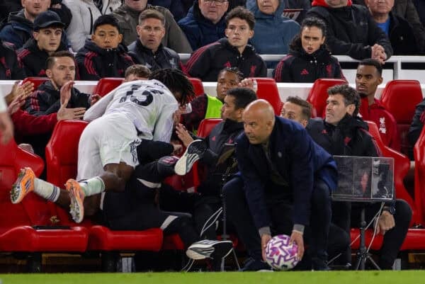 LIVERPOOL, ENGLAND - Sunday, October 19, 2025: Manchester United's Patrick Dorgu falls into the Liverpool substitutes during the FA Premier League match between Liverpool FC and Manchester United FC at Anfield. (Photo by David Rawcliffe/Propaganda)