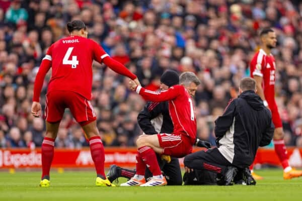LIVERPOOL, ENGLAND - Sunday, October 19, 2025: Liverpool's captain Virgil van Dijk (L) helps up Alexis Mac Allister after he received treatment during the FA Premier League match between Liverpool FC and Manchester United FC at Anfield. (Photo by David Rawcliffe/Propaganda)