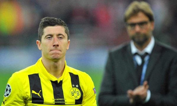 Picture by: Martin Rickett / PA Archive/Press Association Images Borussia Dortmund Robert Lewandowski looks dejected a he leaves the pitch past manager Jurgen Klopp after the UEFA Champions League Final at Wembley Stadium, London.