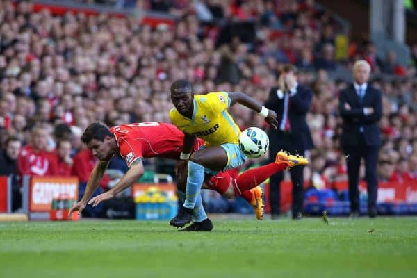 Liverpool's Dejan Lovren (left) and Crystal Palace's Pape N'Diaye Souare (right) battle for the ball during the Barclays Premier League match at Anfield, Liverpool. Saturday May 16, 2015. Photo: Peter Byrne/PA Wire.