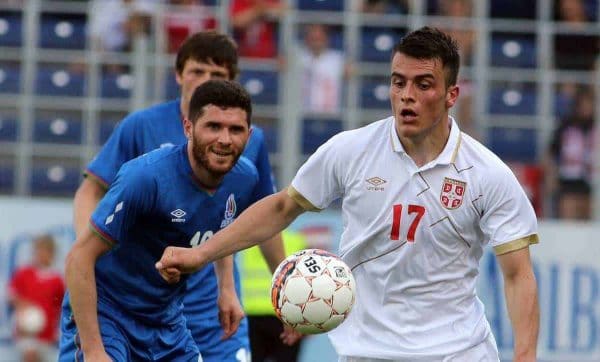 Serbia's Filip Kostic, right, challenges with Azerbaijan's Huseynov Javid, left, for the ball during a friendly soccer match between Serbia and Azerbaijan in St. Poelten, Austria, Sunday, June 7, 2015. (AP Photo/Ronald Zak)