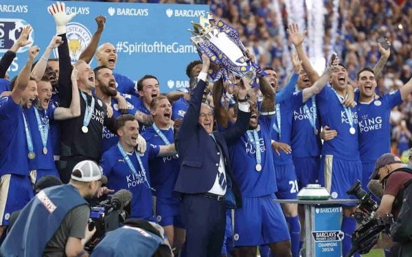 Leicester¬ís team manager Claudio Ranieri and Leicester¬ís Wes Morgan lift the trophy as Leicester City celebrate becoming the English Premier League soccer champions at King Power stadium in Leicester, England, Saturday, May 7, 2016.(AP Photo/Matt Dunham)