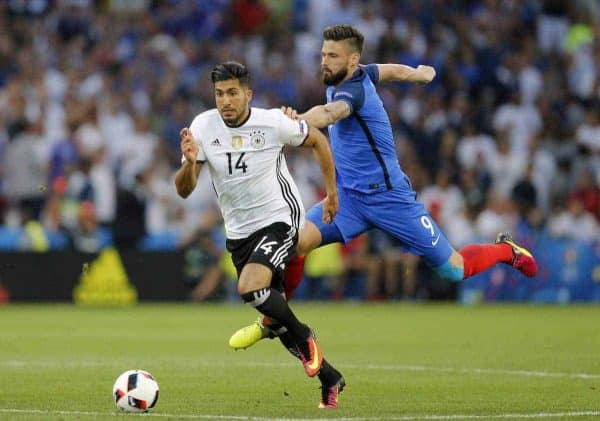 France's Olivier Giroud, right, holds Germany's Emre Can during the Euro 2016 semifinal soccer match between Germany and France, at the Velodrome stadium in Marseille, France, Thursday, July 7, 2016. (AP Photo/Michael Probst)