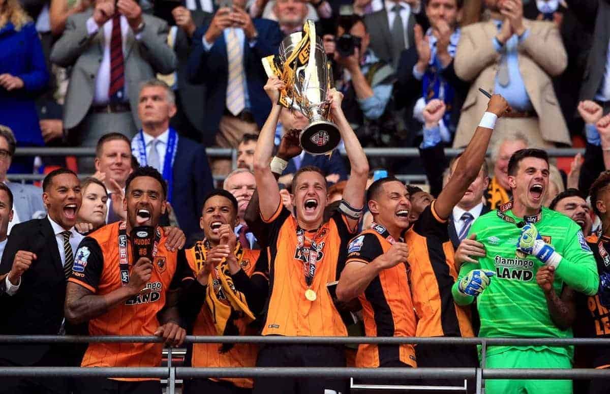 Hull City's Michael Dawson lifts the trophy after winning the Championship Play-Off Final