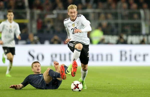 England's Eric Dier (left) and Germany's Julian Brandt (right) battle for the ball