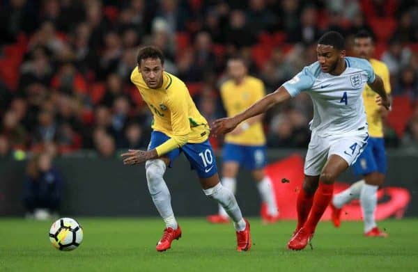 Brazil's Neymar (left) and England's Joe Gomez in action during the Bobby Moore Fund International match at Wembley Stadium, London.