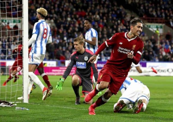 Liverpool's Roberto Firmino (right) celebrates scoring his side's second goal of the game during the Premier League match at the John Smith's Stadium, Huddersfield.