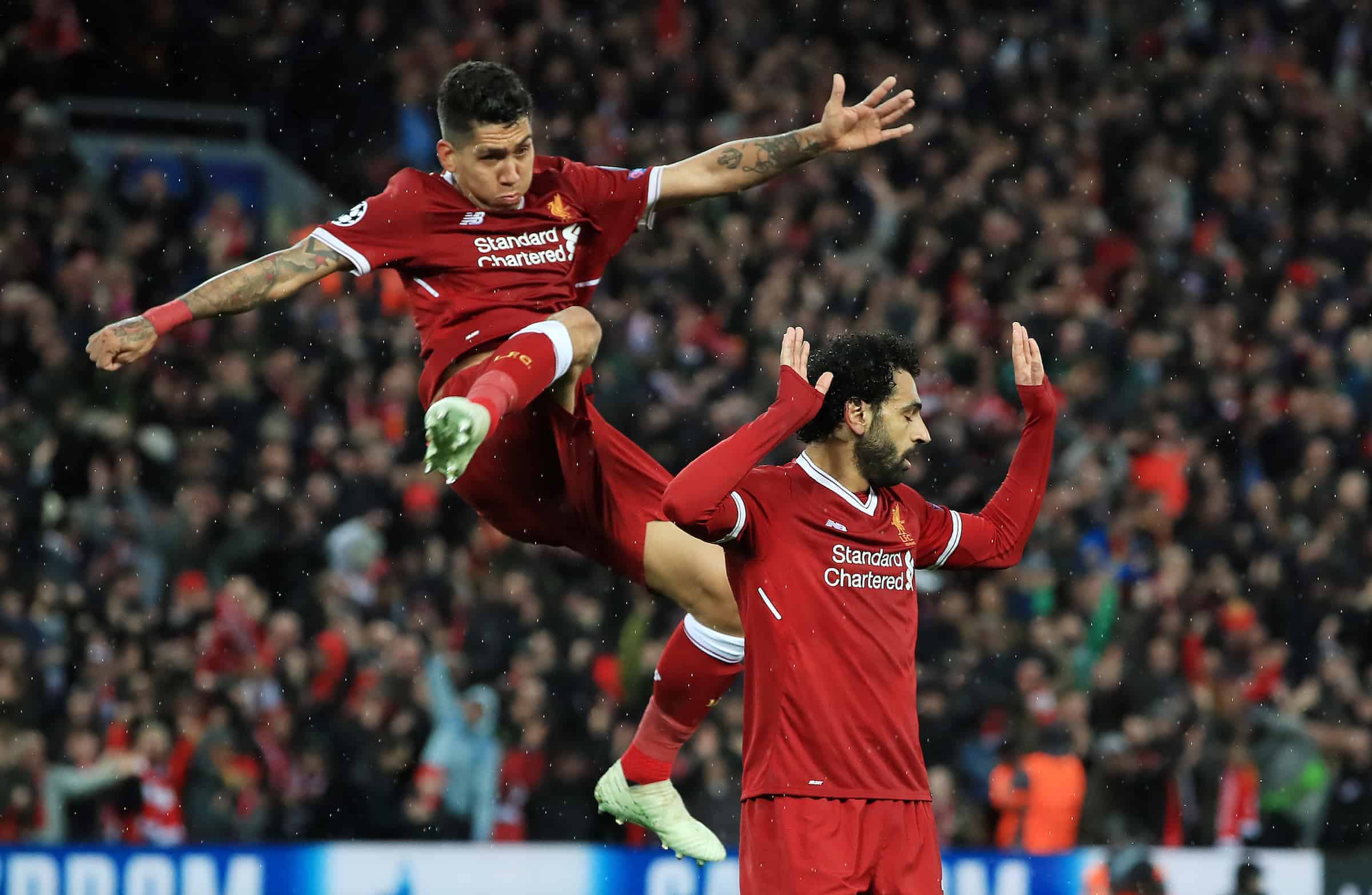 Liverpool's Mohamed Salah (right) celebrates scoring his side's second goal of the game with Roberto Firmino during the UEFA Champions League, Semi Final First Leg match at Anfield, Liverpool.