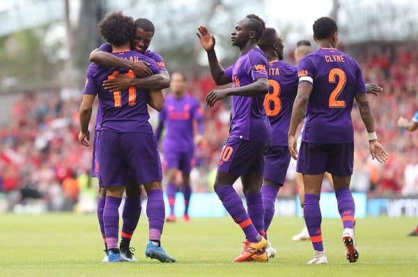 Liverpool's Mohamed Salah (left) celebrates scoring his sides third goak of the match with team mates during the pre-season friendly match at the Aviva Stadium, Dublin. ( Niall Carson/PA Wire/PA Images)