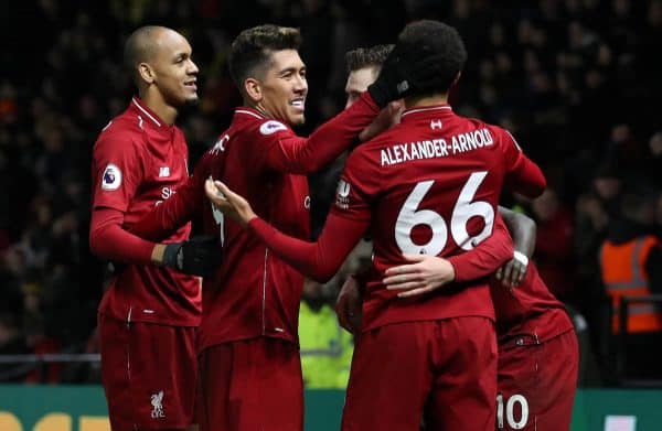 Liverpool's Roberto Firmino (second left) celebrates scoring his side's third goal of the game with team mates during the Premier League match at Vicarage Road, Watford.