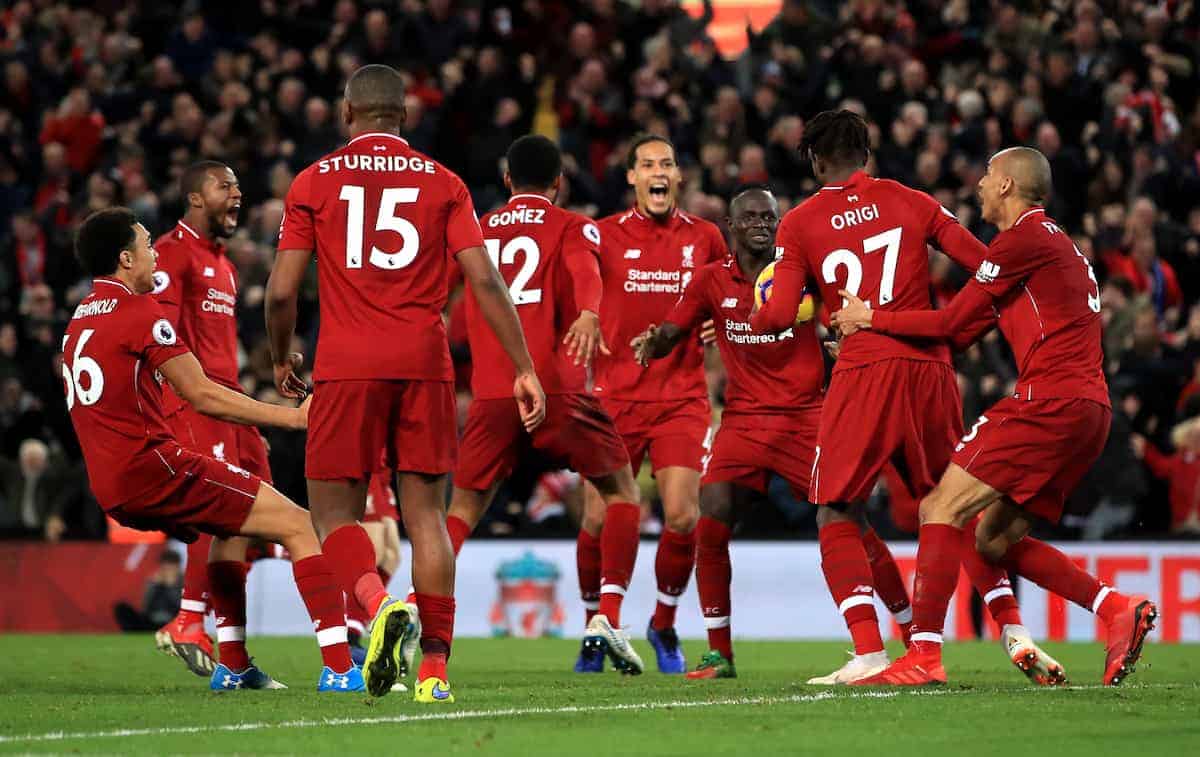 Liverpool's Divock Origi (second right) celebrates scoring his side's first goal of the game with team mates during the Premier League match at Anfield, Liverpool. (Peter Byrne/PA Wire/PA Images)