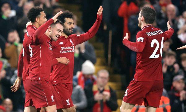 Liverpool's Xherdan Shaqiri (second left) celebrates scoring his side's third goal of the game with team-mates during the Premier League match at Anfield, Liverpool. (Peter Byrne/PA Wire/PA Images)