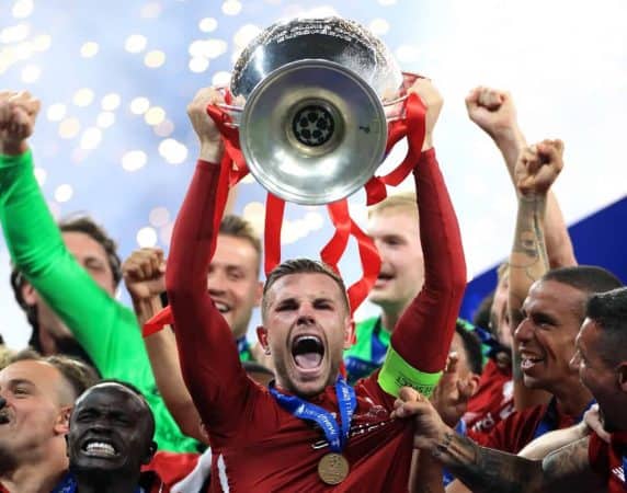 Liverpool's Jordan Henderson lifts the trophy after the final whistle during the UEFA Champions League Final at the Wanda Metropolitano, Madrid. (Image: Mike Egerton/PA Wire.)