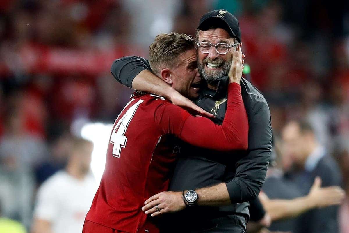 Liverpool's Jordan Henderson celebrates victory with manager Jurgen Klopp after winning the UEFA Champions League Final at the Wanda Metropolitano, Madrid.