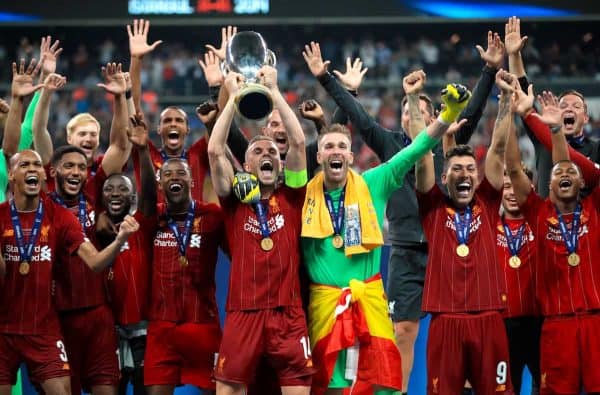 Liverpool's Jordan Henderson lifts the trophy after his side win the UEFA Super Cup Final at Besiktas Park, Istanbul. ( Adam Davy/PA Wire/PA Images)