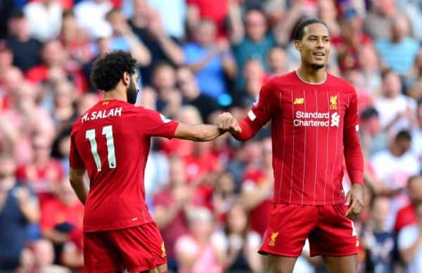 Liverpool's Mohamed Salah (left) celebrates scoring his side's second goal of the game with team-mate Virgil van Dijk during the Premier League match at Anfield, Liverpool. ( Anthony Devlin/PA Wire/PA Images)