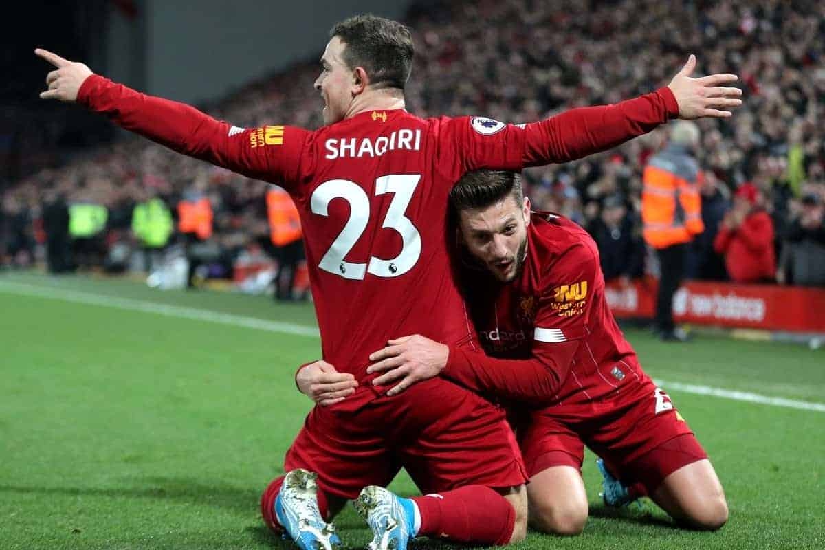 Liverpool's Xherdan Shaqiri (left) celebrates scoring his side's second goal of the game with team-mate Adam Lallana during the Premier League match at Anfield, Liverpool.