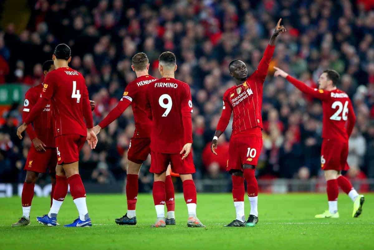 Liverpool's Sadio Mane (second right) celebrates scoring his side's first goal of the game with his team mates during the Premier League match at Anfield Stadium, Liverpool.