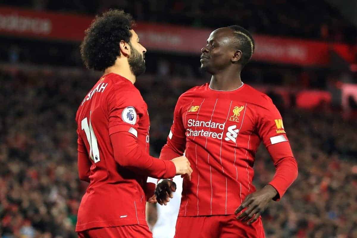 Liverpool's Mohamed Salah (left) celebrates scoring his side's first goal of the game with Sadio Mane during the Premier League match at Anfield, Liverpool.