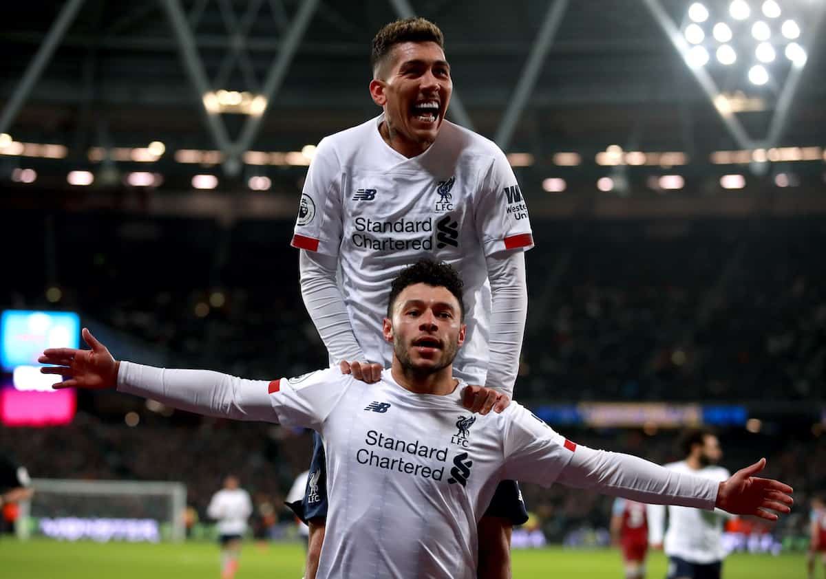 Liverpool's Alex Oxlade-Chamberlain celebrates scoring his side's second goal of the game with team mate Roberto Firmino during the Premier League match at London Stadium. PA Image: Adam Davy/PA Wire.